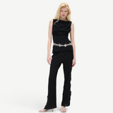 KABE SHOP INC Malaika pants in black with a straight-leg silhouette, worn by a blonde model with a silver belt.