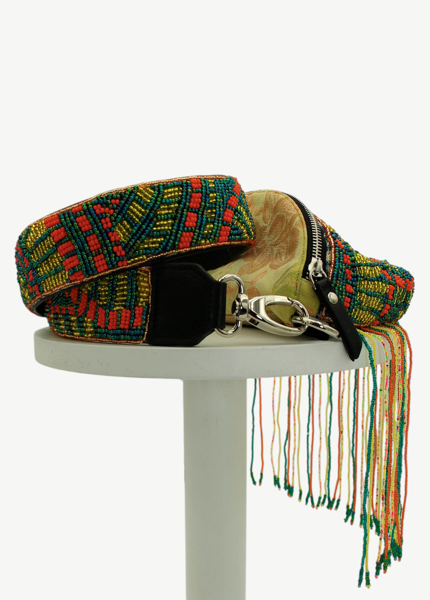 KABE SHOP INC Baubau Rio bag featuring intricate multi-colored beadwork, a zipper closure, and long beaded fringe.