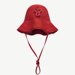 KABE SHOP INC red woven straw hat bag with a structured bucket silhouette and decorative braided emblem
