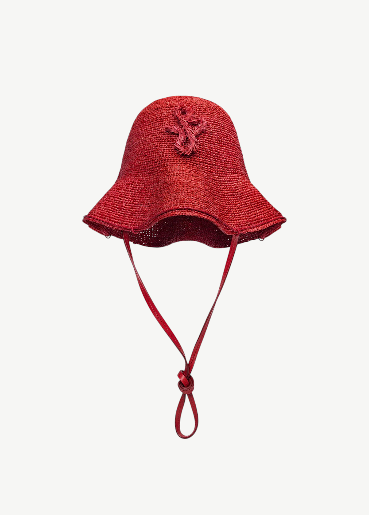 KABE SHOP INC red woven straw hat bag with a structured bucket silhouette and decorative braided emblem