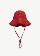 KABE SHOP INC red woven straw hat bag with a structured bucket silhouette and decorative braided emblem