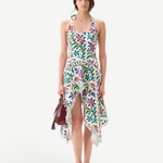 Model wearing KABE SHOP INC Belora cotton dress with floral pixel print, asymmetric hem, and raw-edge detailing.