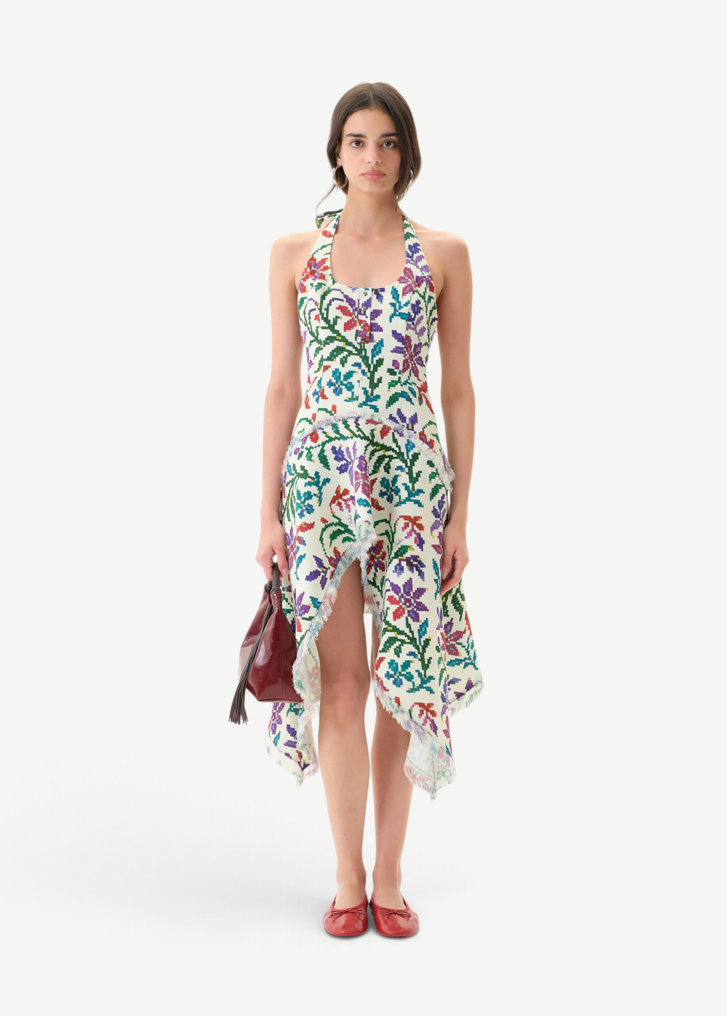 Model wearing KABE SHOP INC Belora cotton dress with floral pixel print, asymmetric hem, and raw-edge detailing.