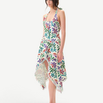 Model wearing KABE SHOP INC Belora cotton dress with floral embroidery, asymmetric hem, and raw-edge detailing.