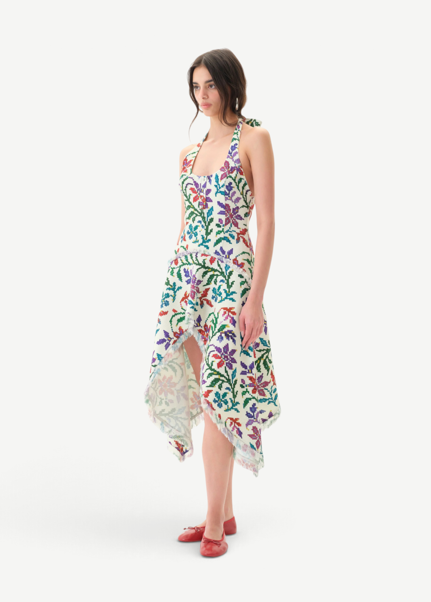 Model wearing KABE SHOP INC Belora cotton dress with floral embroidery, asymmetric hem, and raw-edge detailing.
