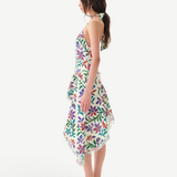 Model wearing KABE SHOP INC Belora cotton dress with floral embroidery, asymmetric hem, and raw-edge detailing.