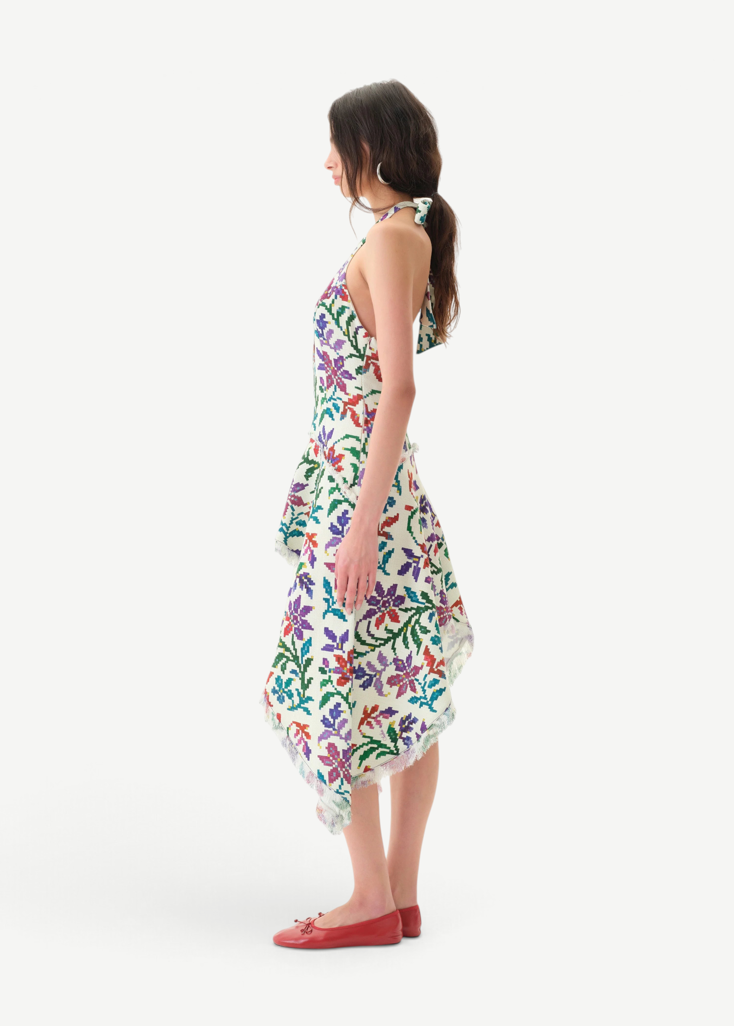 Model wearing KABE SHOP INC Belora cotton dress with floral embroidery, asymmetric hem, and raw-edge detailing.