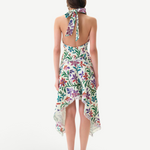 Back view of KABE SHOP INC Belora cotton dress with floral print, halter neck, and raw-edge asymmetric hemline.