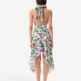 Back view of KABE SHOP INC Belora cotton dress with floral print, halter neck, and raw-edge asymmetric hemline.