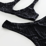KABE SHOP INC black microfiber bikini set with high-cut Brazilian bottoms and rhinestone pinstripe embellishments.