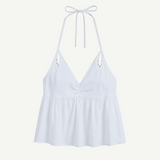 KABE SHOP INC white keyhole halter top with a V-neckline, gathered bust, and delicate tie straps.