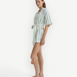 Model wearing KABE SHOP INC Finn wrap tunic in white and blue striped lightweight fabric with a waist tie