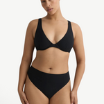Model wearing KABE SHOP INC Gracie black bikini top with a supportive silhouette and clean lines