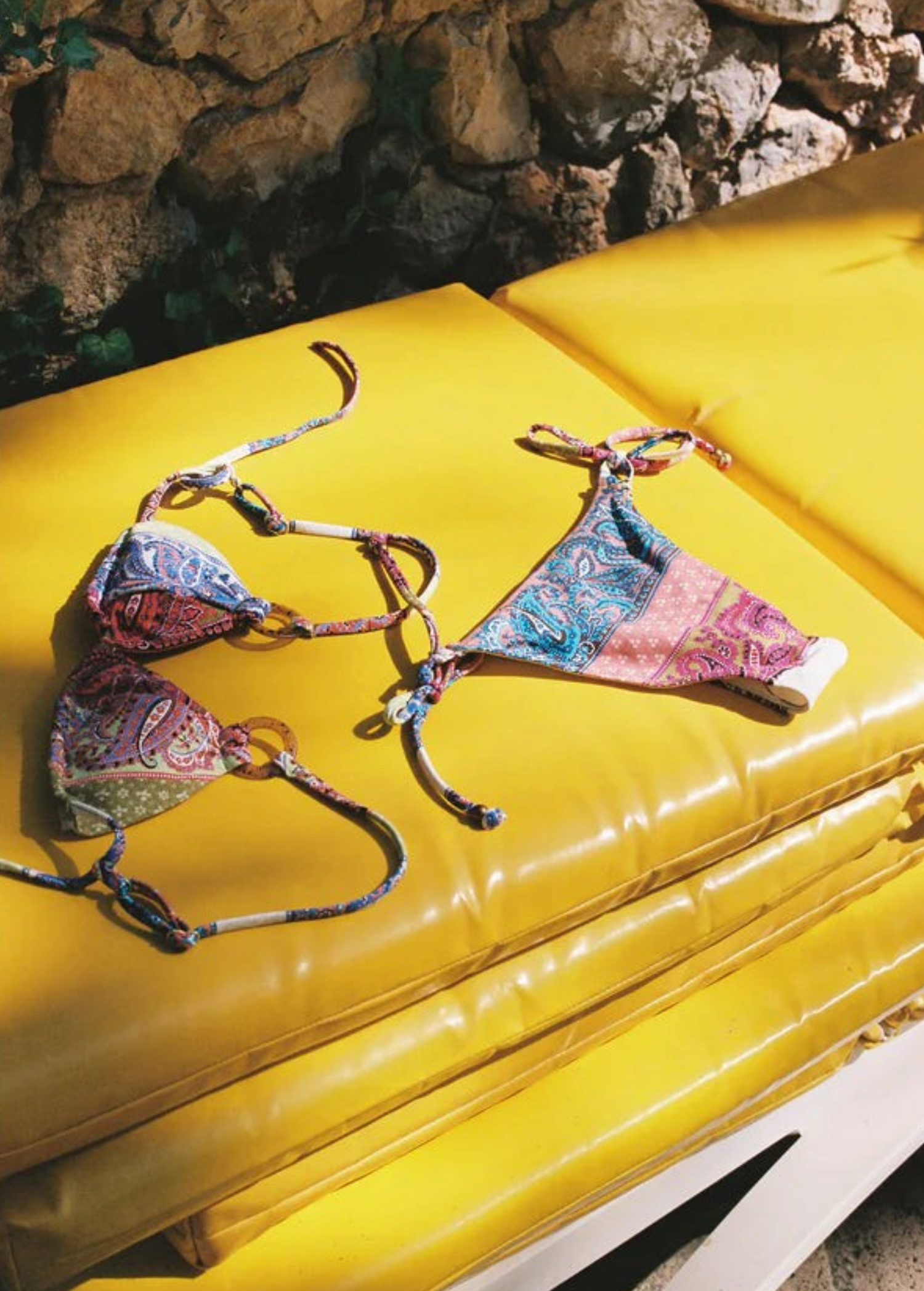 KABE SHOP INC Marseille paisley print bikini set with tie-side bottoms and gold hardware on yellow sun loungers