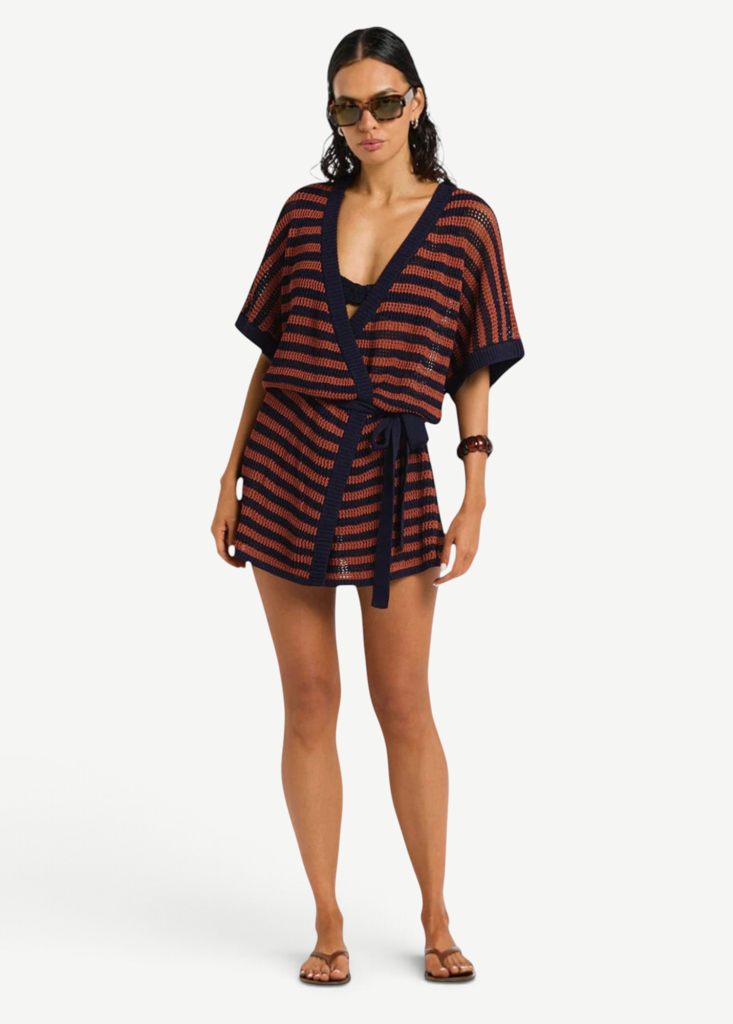 Model wearing KABE SHOP INC Nova knit robe with navy and rust stripes, short sleeves, and a tie waist belt.