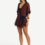 Model wearing KABE SHOP INC Nova knit robe with navy and rust stripes, featuring a belted waist and relaxed fit.