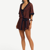 Model wearing KABE SHOP INC Nova knit robe with navy and rust stripes, featuring a belted waist and relaxed fit.