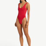 KABE SHOP INC Mara red one-piece swimsuit with a V-neckline, scoop back, and high-cut leg on a model