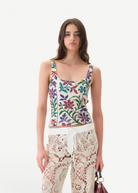Model wearing KABE SHOP INC Cali Top featuring a multi-colored floral tapestry print with wide straps