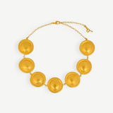 KABE SHOP INC Wasi choker featuring sculptural golden spheres inspired by Tayrona culture on a delicate chain