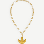 KABE SHOP INC Wanpu necklace featuring a gold anthropomorphic pendant on a thick chain inspired by Tayrona artistry.