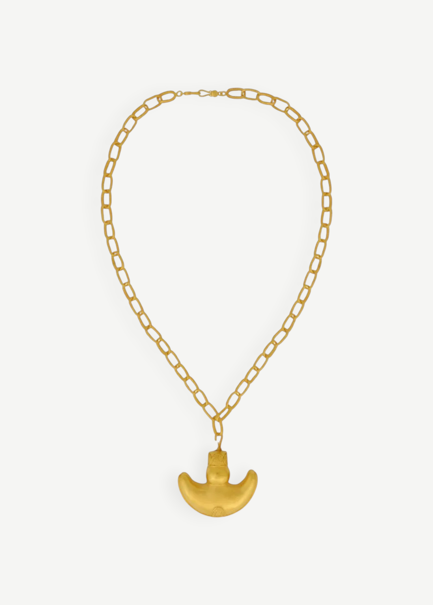 KABE SHOP INC Wanpu necklace featuring a gold anthropomorphic pendant on a thick chain inspired by Tayrona artistry.
