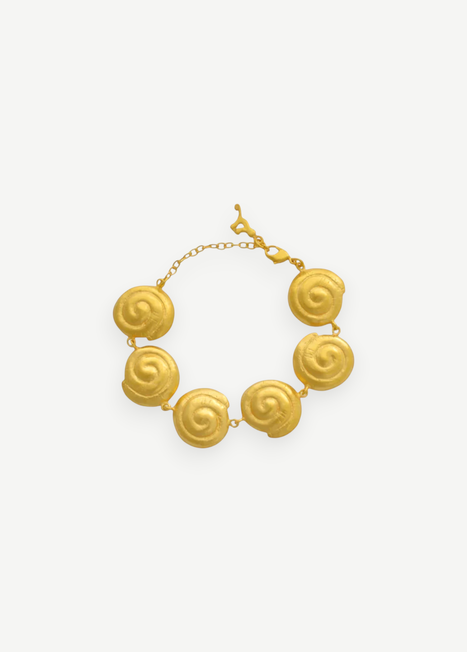 KABE SHOP INC Allinmi gold bracelet featuring Tairona-inspired spiral charms and a delicate chain clasp