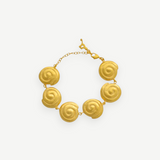 KABE SHOP INC Allinmi gold bracelet featuring Tairona-inspired spiral charms and a delicate chain clasp