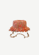 KABE SHOP INC handcrafted multi-colored crochet bucket hat with fringe trim and a decorative seashell chin strap.
