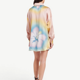 Model wearing a KABE SHOP INC Hibiscus Top in multi-colored silk with a floral print, back view.