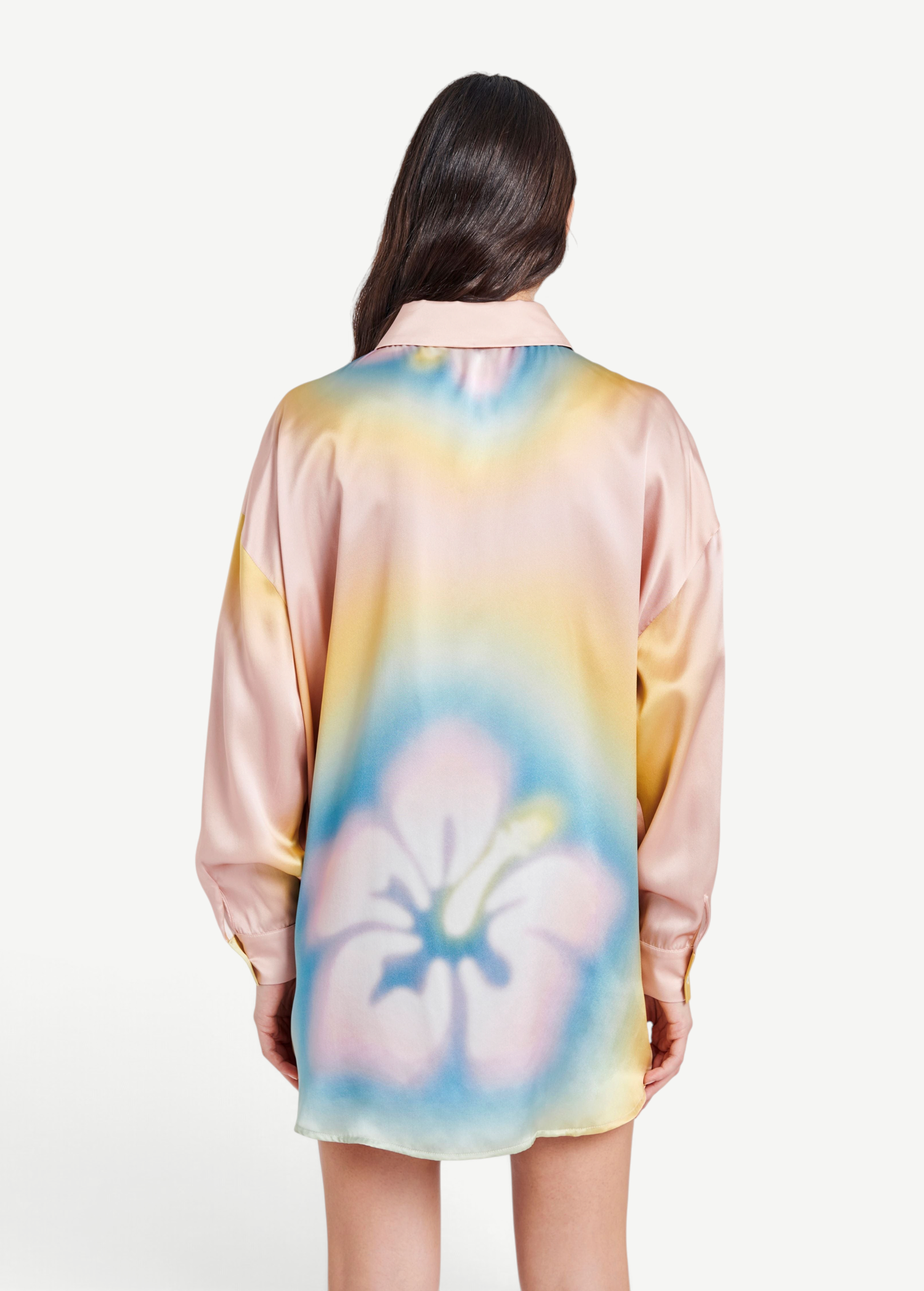 Back view of KABE SHOP INC Hibiscus Top in pastel silk with a large floral print and relaxed button-down silhouette.