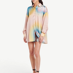 Model wearing a KABE SHOP INC Hibiscus Top in multicolored silk with a button-down collar and relaxed fit