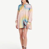 Model wearing a KABE SHOP INC Hibiscus Top in multicolored silk with a button-down collar and relaxed fit