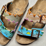 KABE SHOP INC hand-painted Birkenstocks sandals featuring a tropical palm tree design and artisanal embroidery.