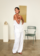 KABE SHOP INC Sebastian strapless white top with side ties paired with matching floral embroidered wide-leg trousers
