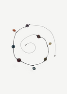 KABE SHOP INC handcrafted necklace with natural agate, moonstone, labradorite, and carnelian on a black leather cord.