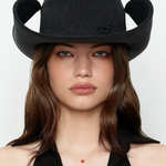 KABE SHOP INC black denim cowboy hat with a structured, wide-brimmed silhouette worn by a woman