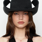 KABE SHOP INC black denim cowboy hat with a structured, wide-brimmed silhouette worn by a woman