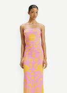 KABE SHOP INC Daphne Dress in pink with yellow floral print, strapless midi silhouette on a model