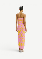 KABE SHOP INC Daphne dress in pink with yellow floral print, strapless maxi silhouette worn by a model, back view