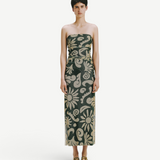 Model wearing KABE SHOP INC Daphne dress, a strapless midi length piece with a dark green and beige floral pattern.