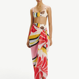 Model wearing KABE SHOP INC Luana Sarong in a vibrant multi-colored floral and striped print over matching bikini