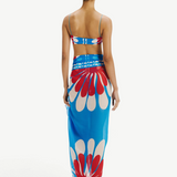 Model wearing KABE SHOP INC Luana sarong in blue and red floral print over matching bikini top, back view