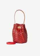 Red woven bucket bag on a white background