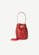 Red woven bucket bag on a white background