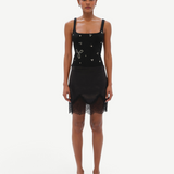 Model wearing KABE SHOP INC Dasne black bodysuit with square neckline and silver stud embellishments