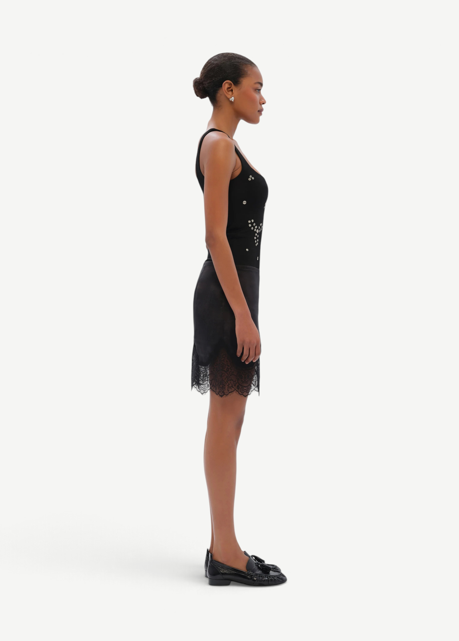 KABE SHOP INC Dasne black bodysuit with square neckline and front embellishment worn by a model in profile view