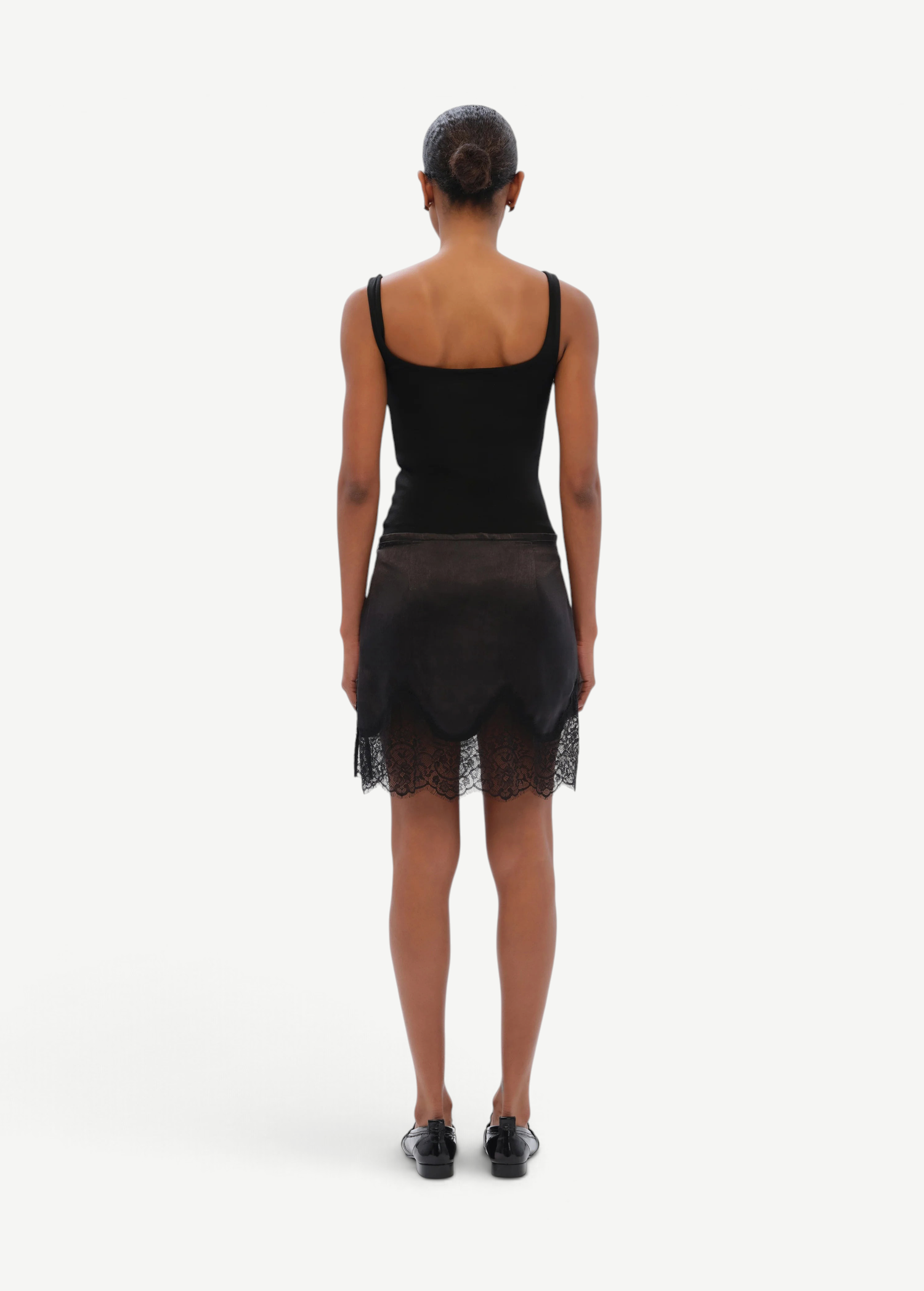 KABE SHOP INC Dasne black bodysuit with square neckline and lace trim skirt, back view on model