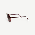 KABE SHOP INC Christopher D sunglasses featuring a deep red translucent frame and gold metal accents, side view.
