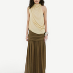 A person wears a beige sleeveless draped top and an Agapito Skirt in dark olive taupe chiffon, creating an elongated silhouette.
